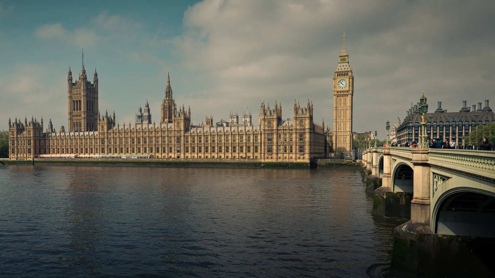 A stunning view of the Houses of Parliament and Big Ben alongside the River Thames in London, England.