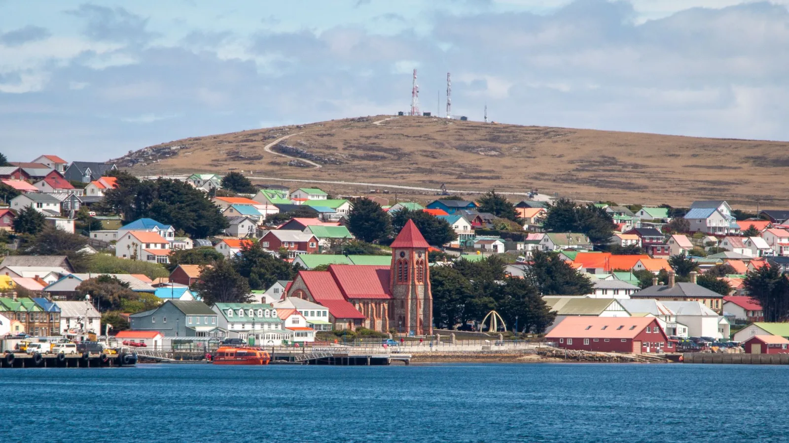Charming harbor view of Stanley with colorful Victorian houses in the Falkland Islands.