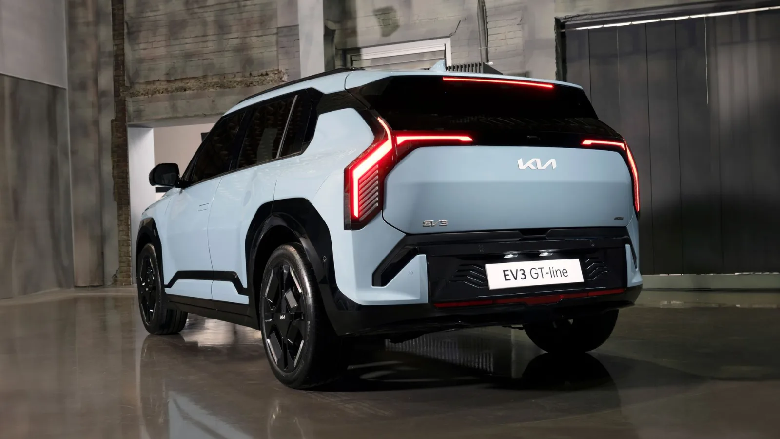 Sleek Kia EV3 GT-Line showcased in a modern interior setting, highlighting its futuristic design.