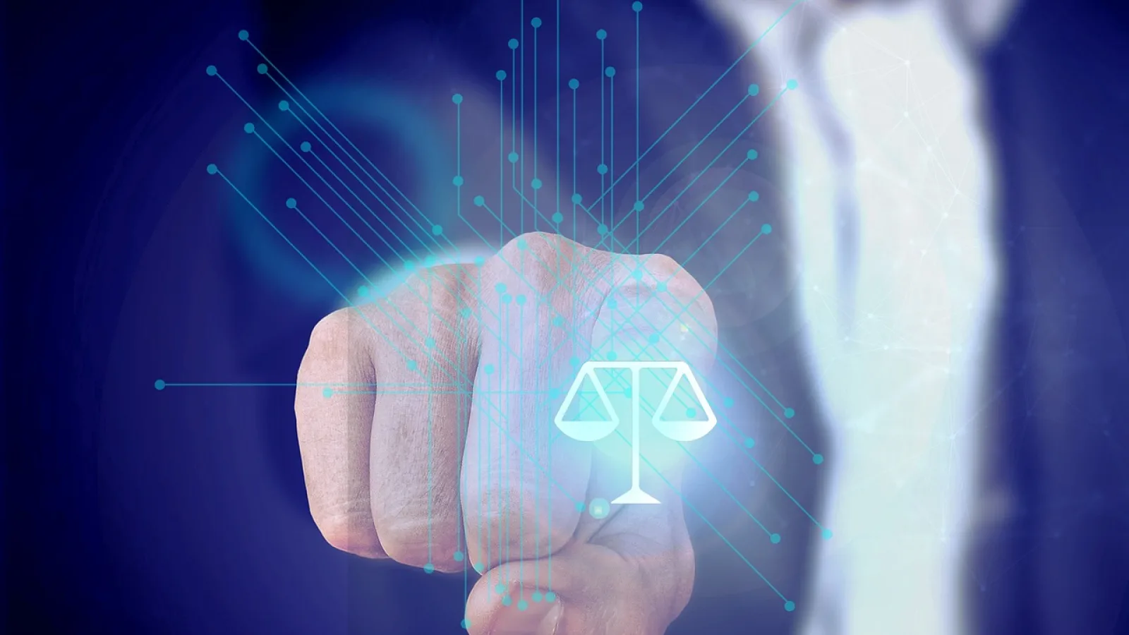 Scales of justice held by robotic hand symbolising AI accountability in law