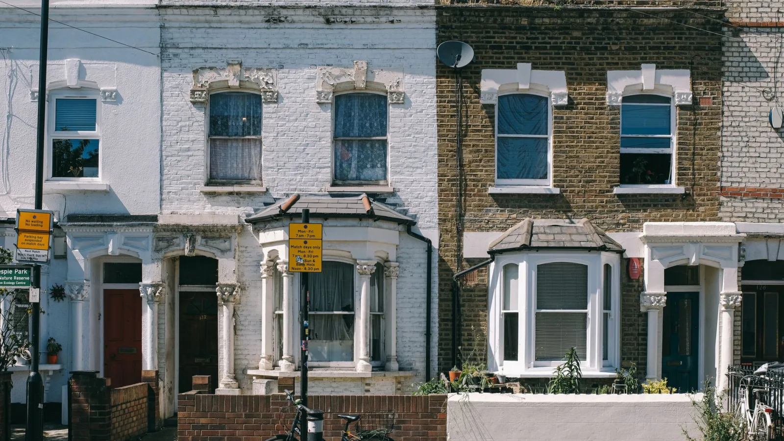 Charming vintage brick facades on a typical residential street in London, United Kingdom.